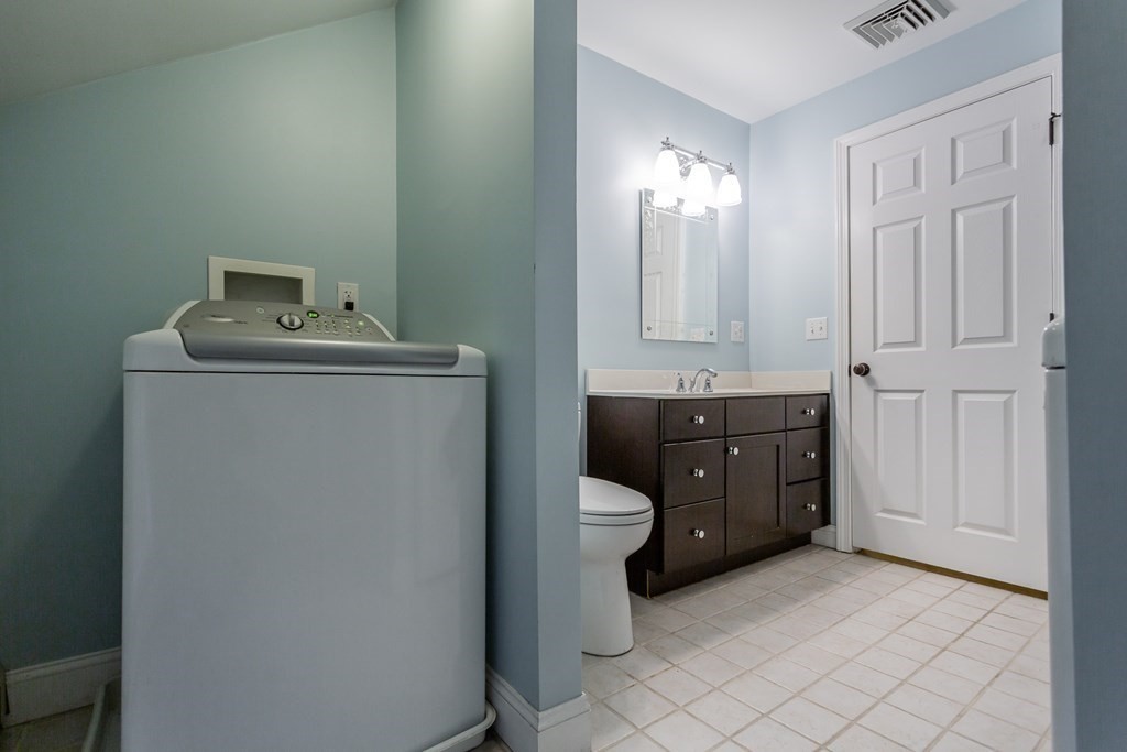 398 Chicago Street Fall River, MA 02721 - Photo 11 of 26 a utility room with a sink dryer and washer