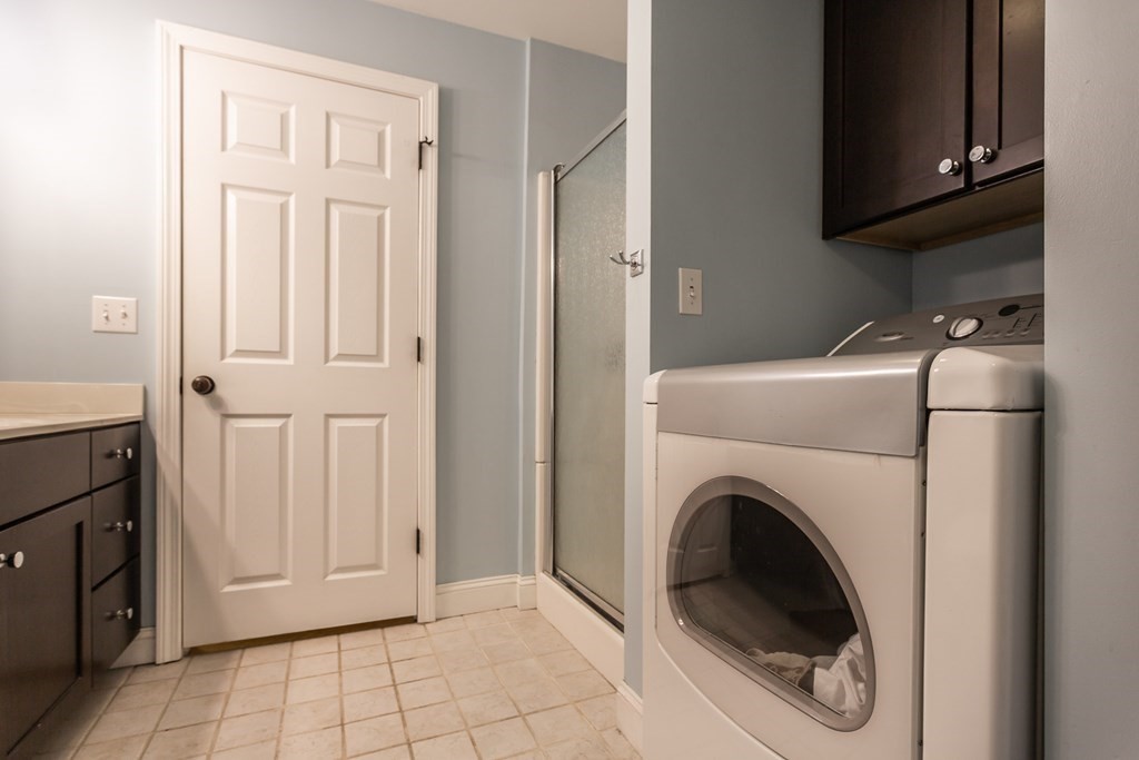 398 Chicago Street Fall River, MA 02721 - Photo 12 of 26 a view of a kitchen with washer and dryer