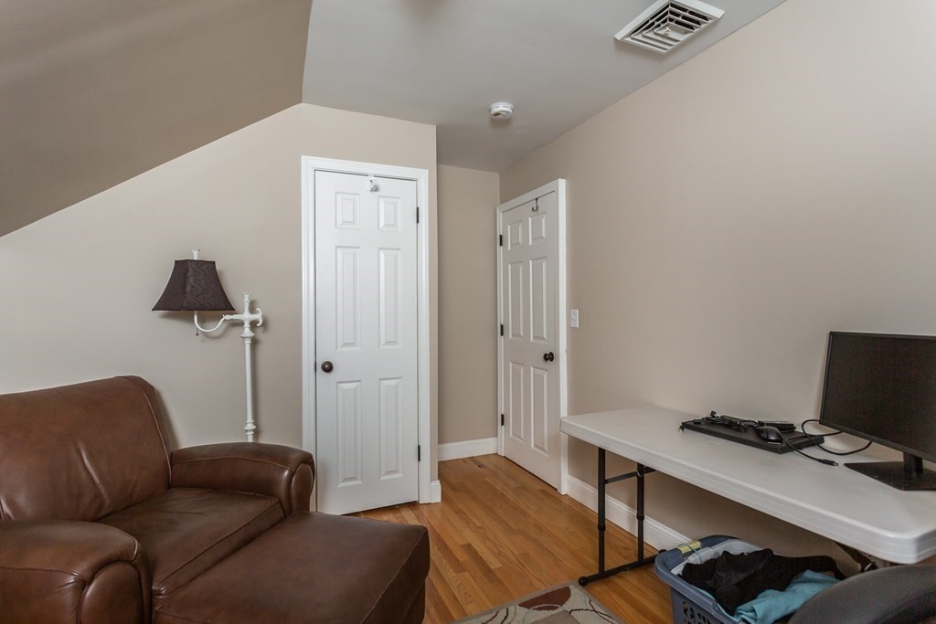 398 Chicago Street Fall River, MA 02721 - Photo 13 of 26 a livingroom with workspace and a couch
