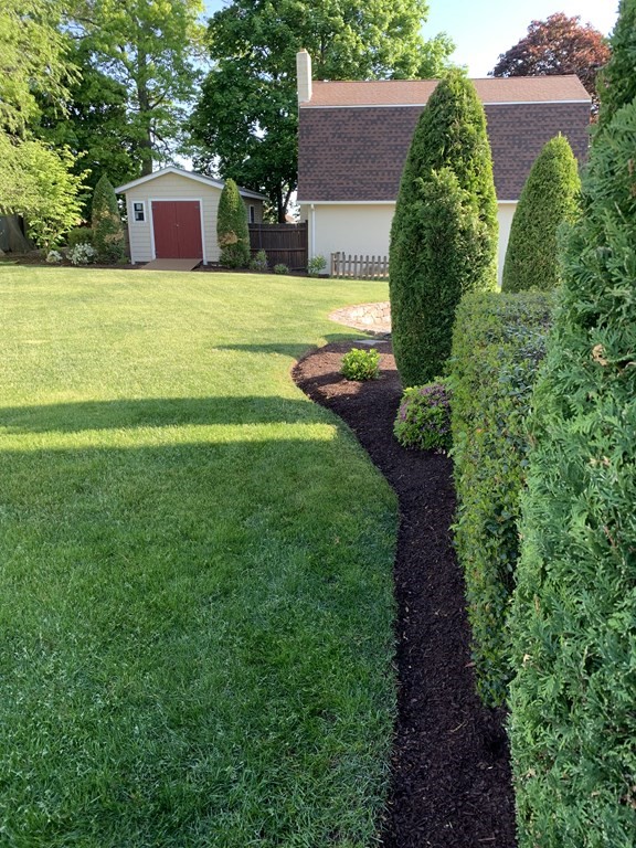 398 Chicago Street Fall River, MA 02721 - Photo 21 of 26 a front view of a house with a yard