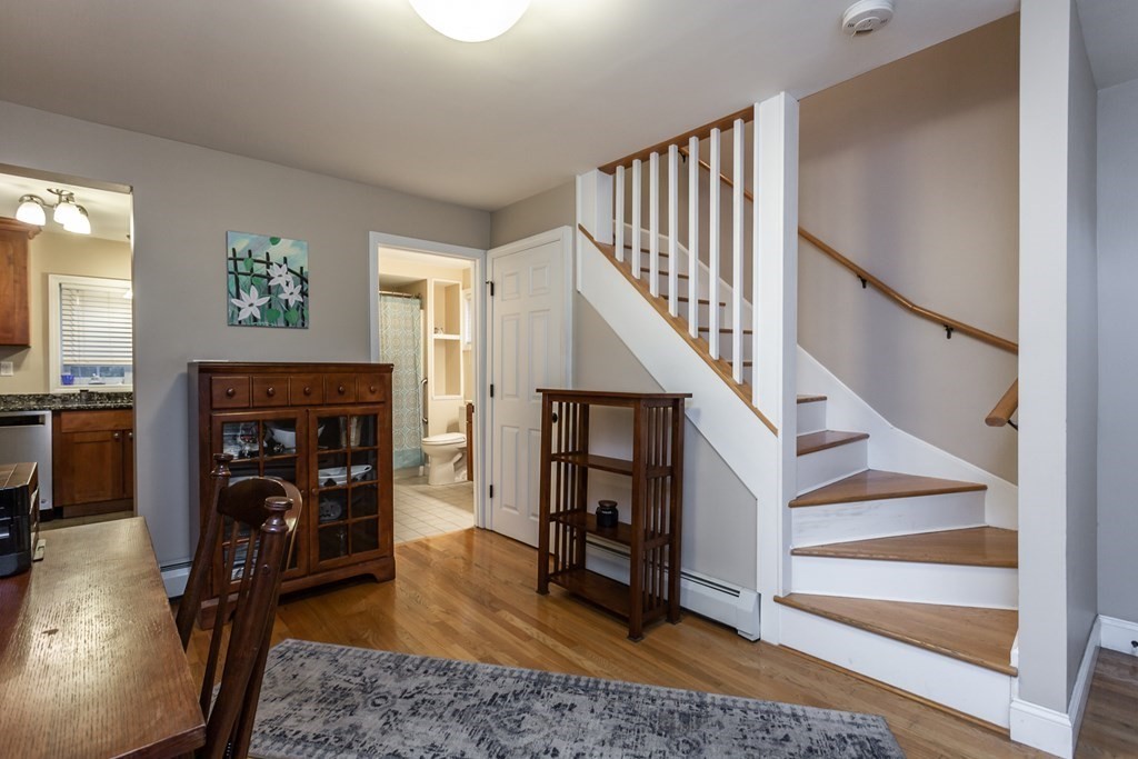 398 Chicago Street Fall River, MA 02721 - Photo 4 of 26 a living room with fireplace furniture and a wooden floor