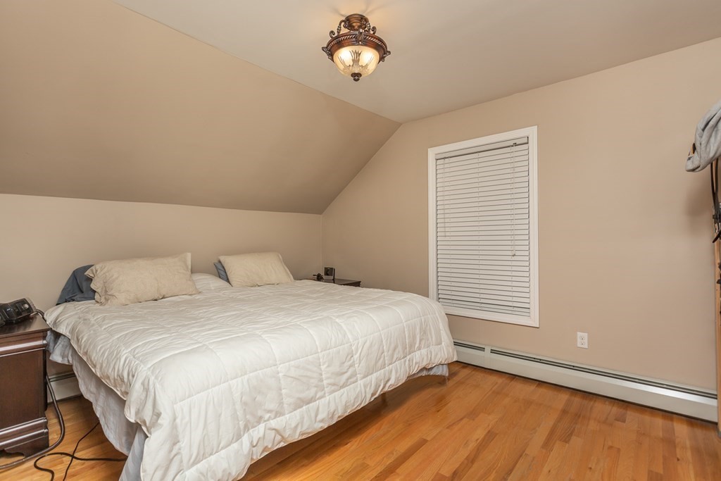 398 Chicago Street Fall River, MA 02721 - Photo 10 of 26 a bedroom with a bed and a window