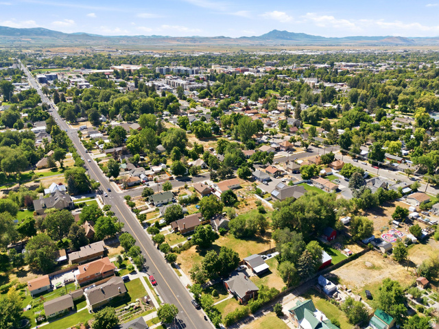 300 East S, Unit 2 Logan, UT 84321 - Photo 24 of 38 Expansive aerial showcasing a residential neighborhood with mature trees and varied architectural styles