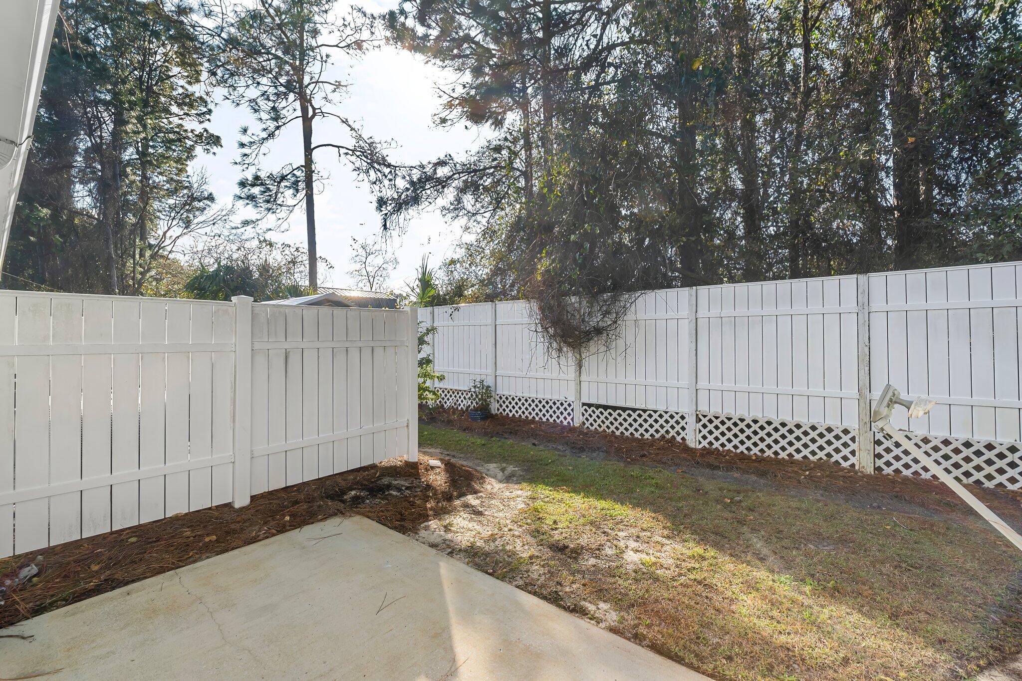 254 South Co Highway 393, Unit 2 Santa Rosa Beach, FL 32459 - Photo 28 of 45 a backyard of a house