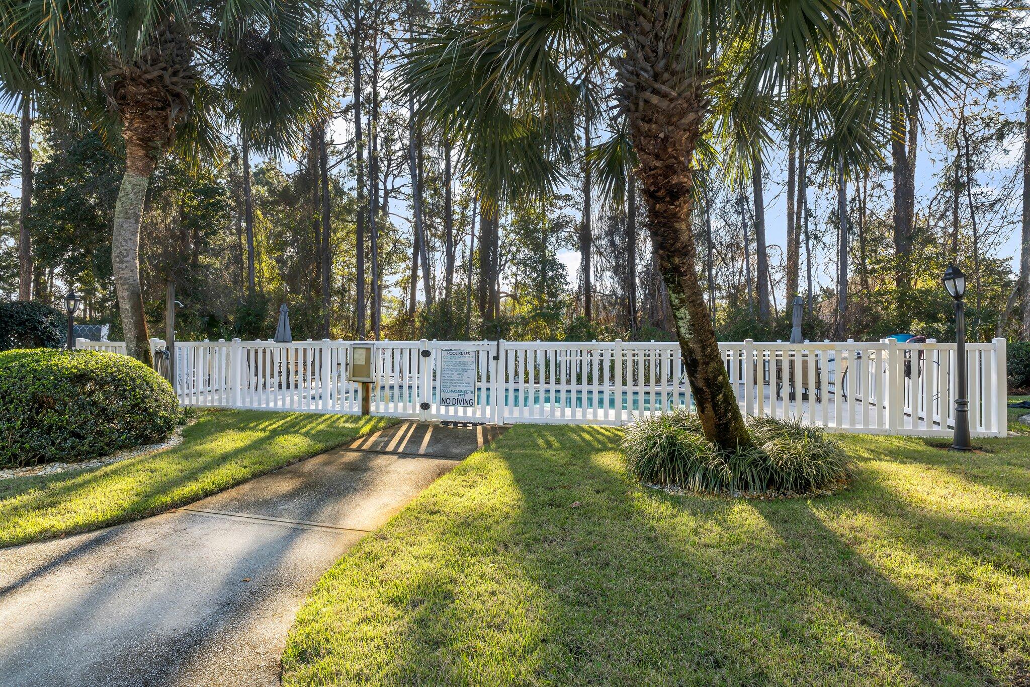 254 South Co Highway 393, Unit 2 Santa Rosa Beach, FL 32459 - Photo 31 of 45 a view of a garden with trees