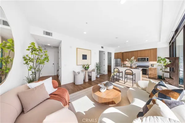 a living room with furniture and a table
