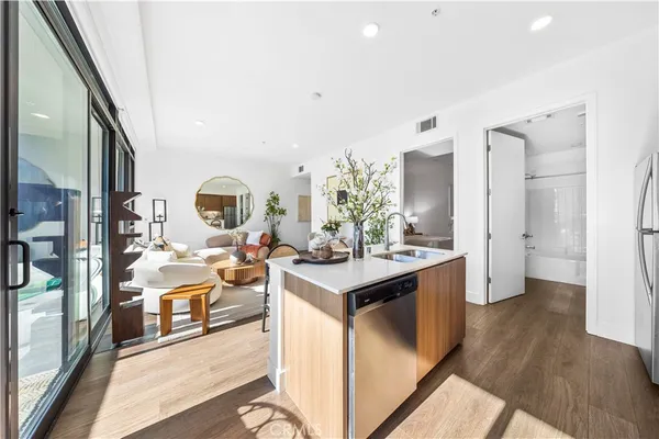 a view of a kitchen cabinets and stainless steel appliances