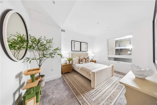 a bedroom with a bed and a table