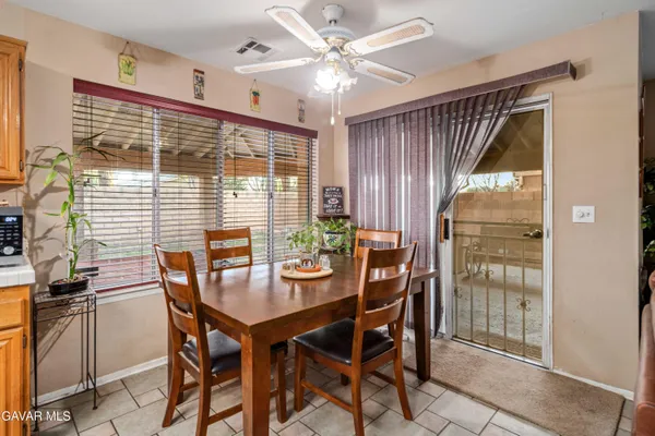 a dining room with furniture and window