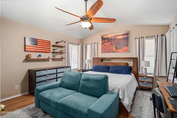 a bedroom with furniture and a window