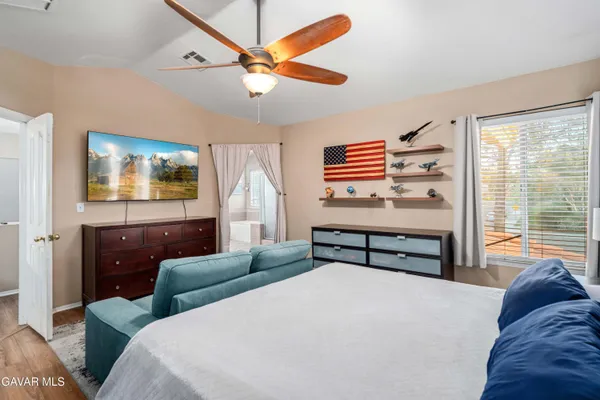 a bedroom with furniture and a window