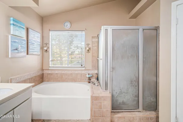 a white bath tub sitting next to a window