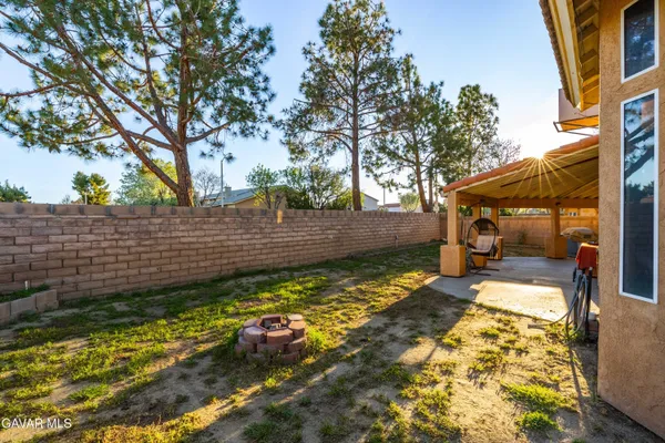 a view of a backyard with sitting area