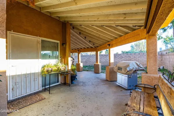 a view of chairs and tables in patio