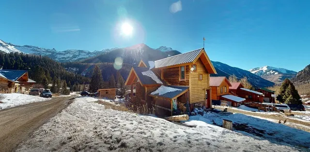 a terrace of a house with outdoor seating
