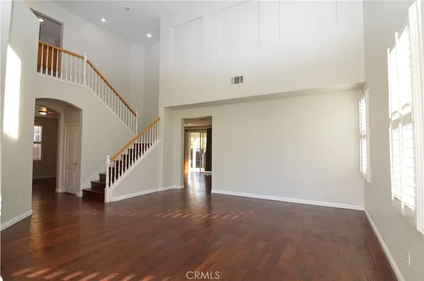 a view of an entryway with wooden floor