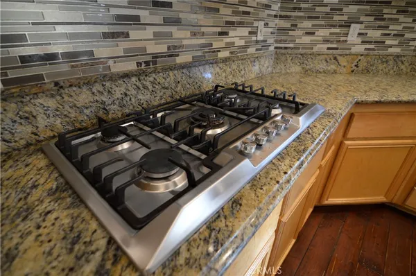 a close up of a stove top oven sitting on a floor