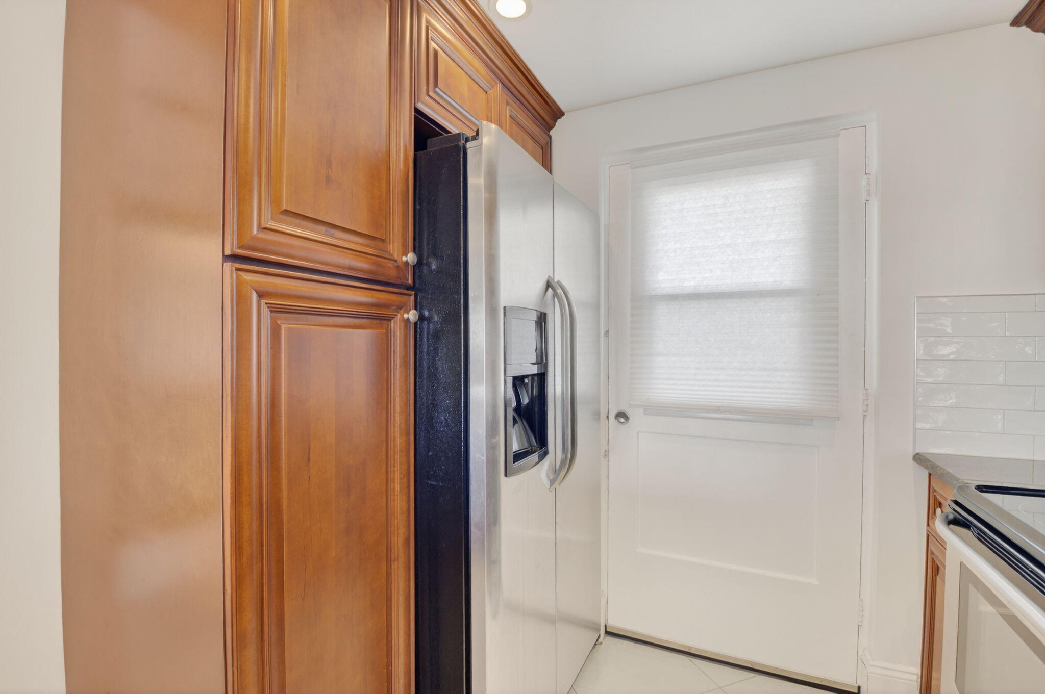 5500 Northwest 2nd Avenue, Unit 718 Boca Raton, FL 33487 - Photo 11 of 34 a bathroom with a shower and a door