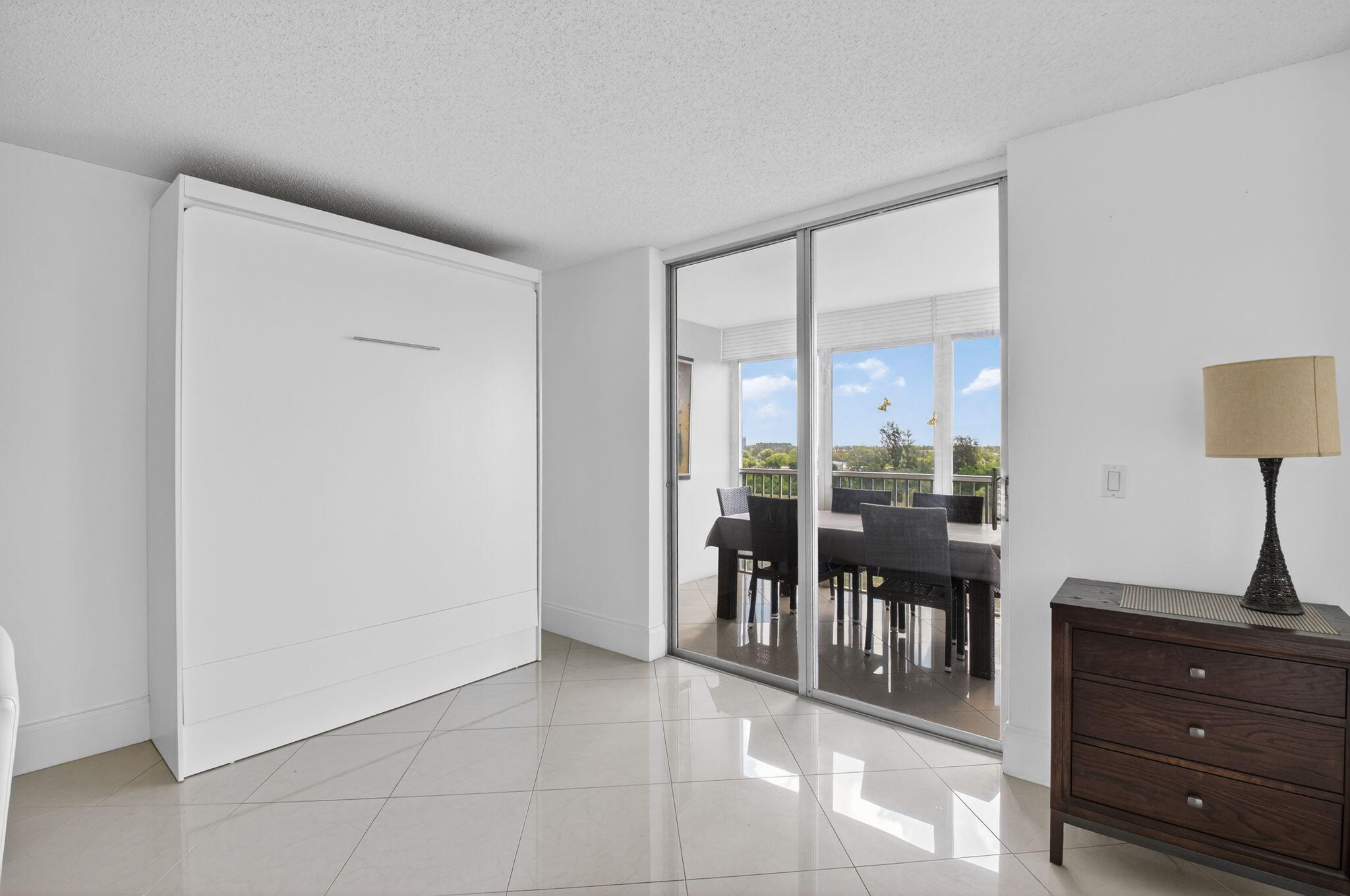 5500 Northwest 2nd Avenue, Unit 718 Boca Raton, FL 33487 - Photo 15 of 34 a view of a room with furniture and floor to ceiling window