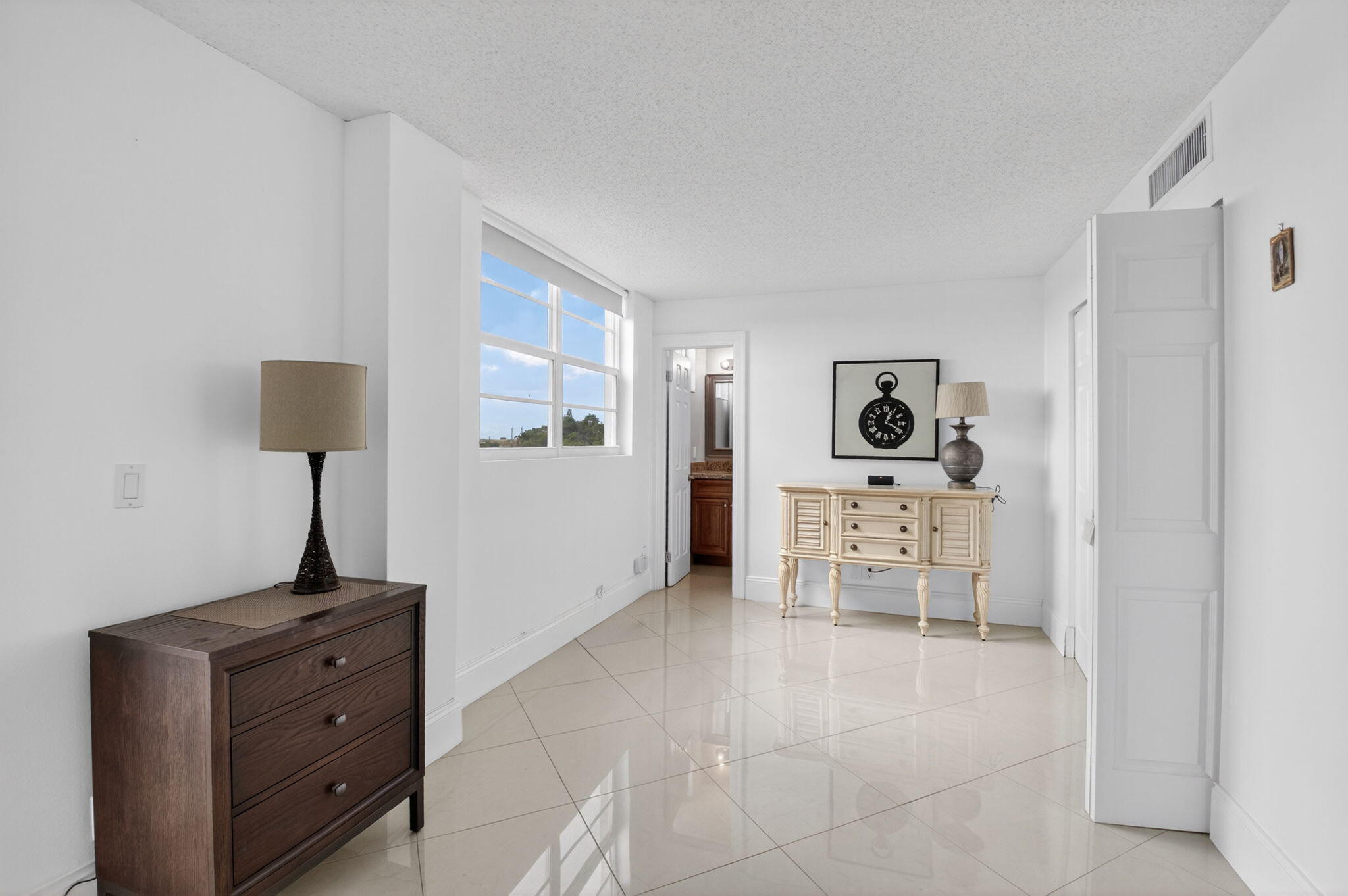 5500 Northwest 2nd Avenue, Unit 718 Boca Raton, FL 33487 - Photo 17 of 34 a living room with furniture and a table