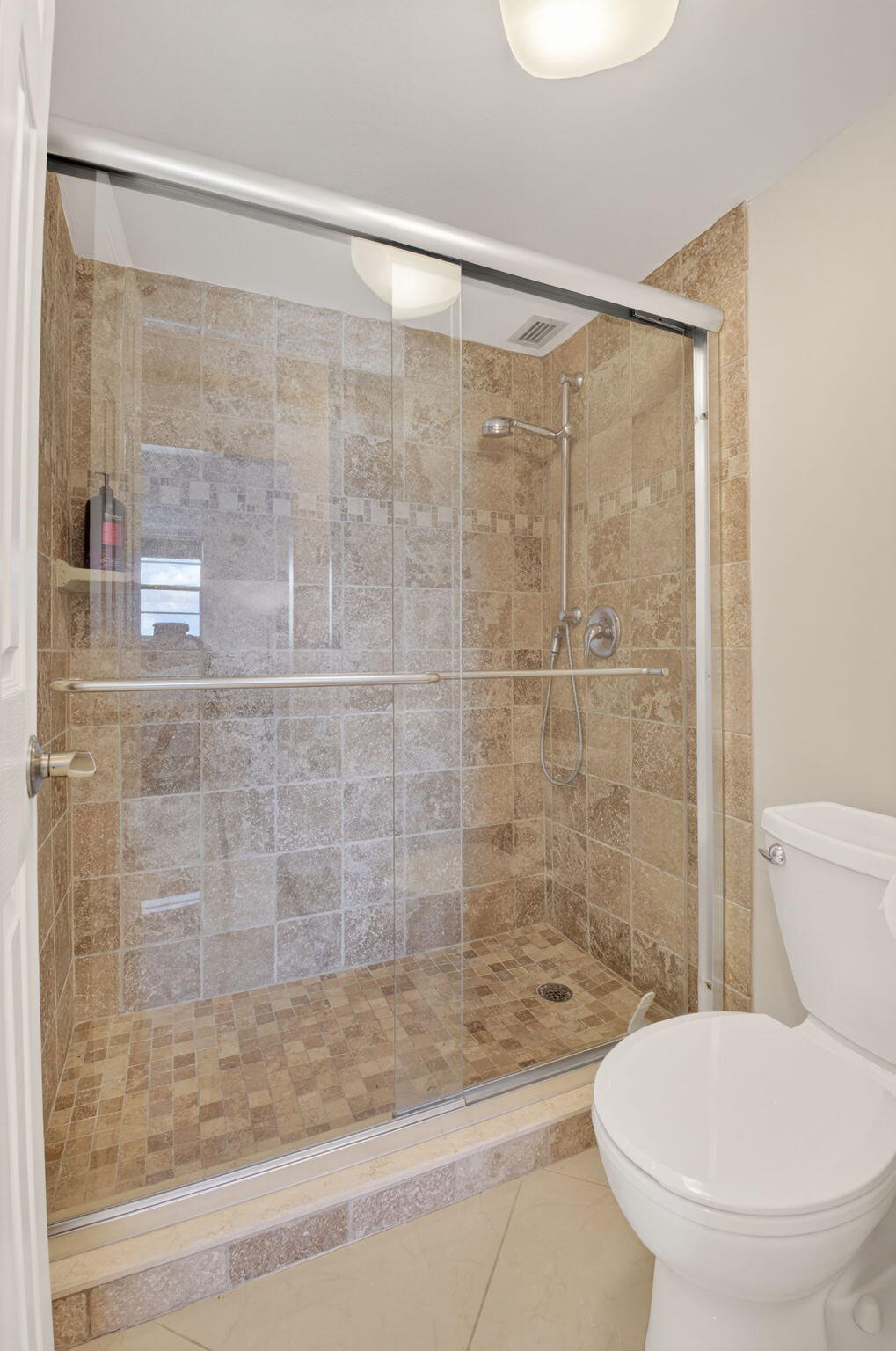 5500 Northwest 2nd Avenue, Unit 718 Boca Raton, FL 33487 - Photo 23 of 34 a bathroom with a toilet and a shower