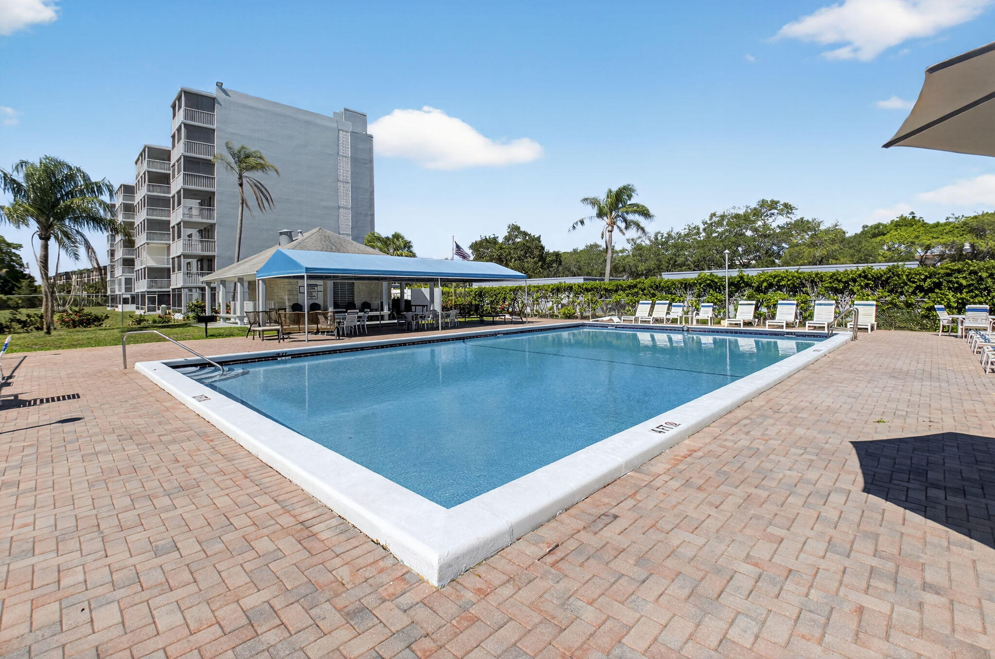 5500 Northwest 2nd Avenue, Unit 718 Boca Raton, FL 33487 - Photo 31 of 34 a view of swimming pool with outdoor seating and lake view