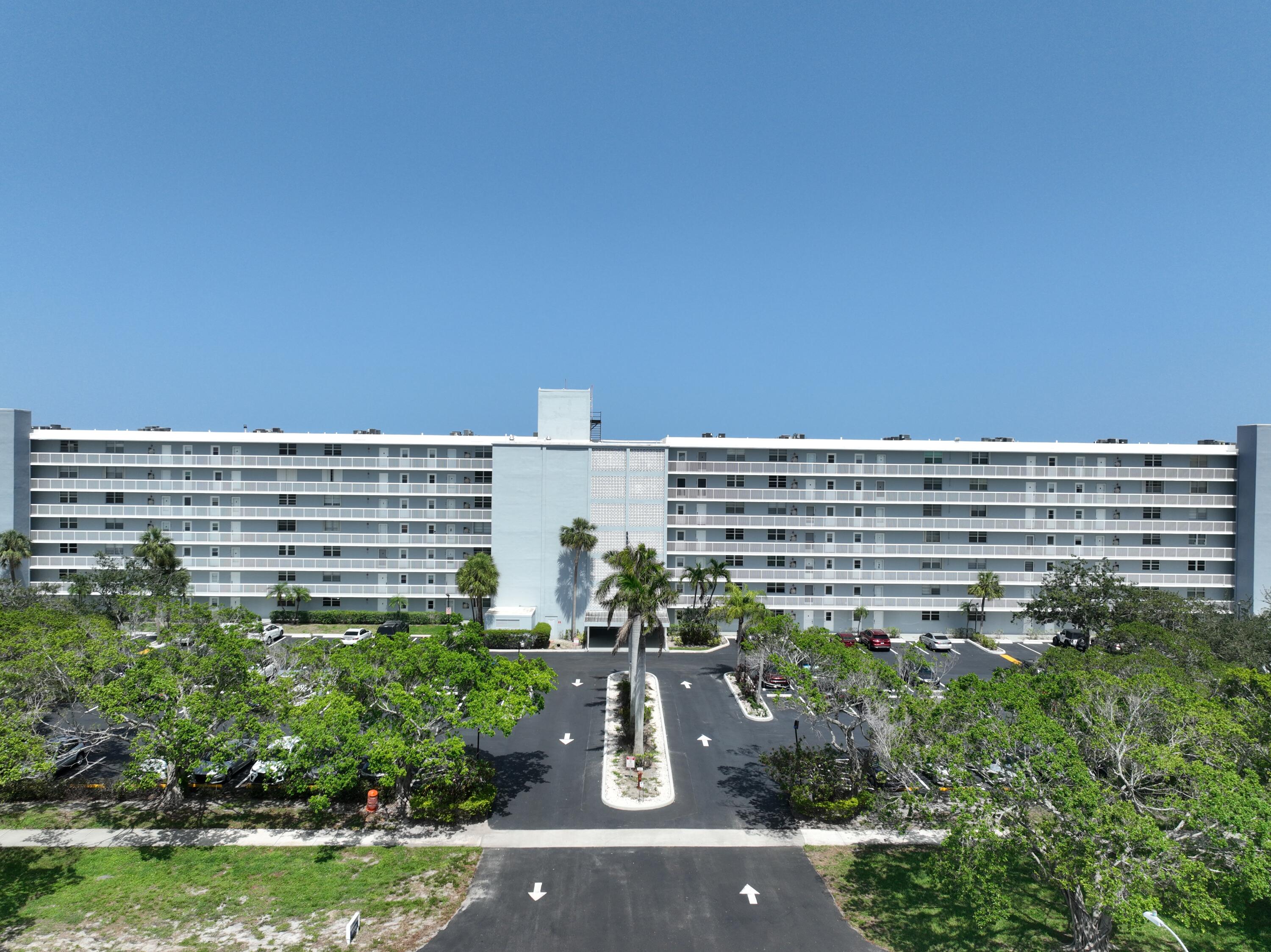 5500 Northwest 2nd Avenue, Unit 718 Boca Raton, FL 33487 - Photo 33 of 34 a view of building with yard and outdoor seating