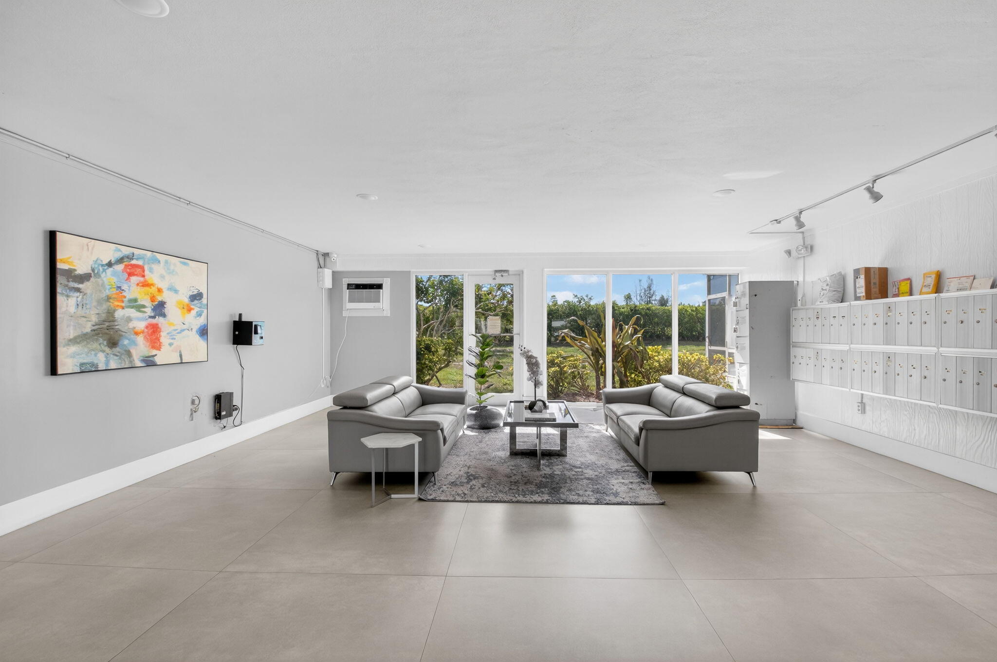 5500 Northwest 2nd Avenue, Unit 718 Boca Raton, FL 33487 - Photo 4 of 34 a living room with furniture and a large window