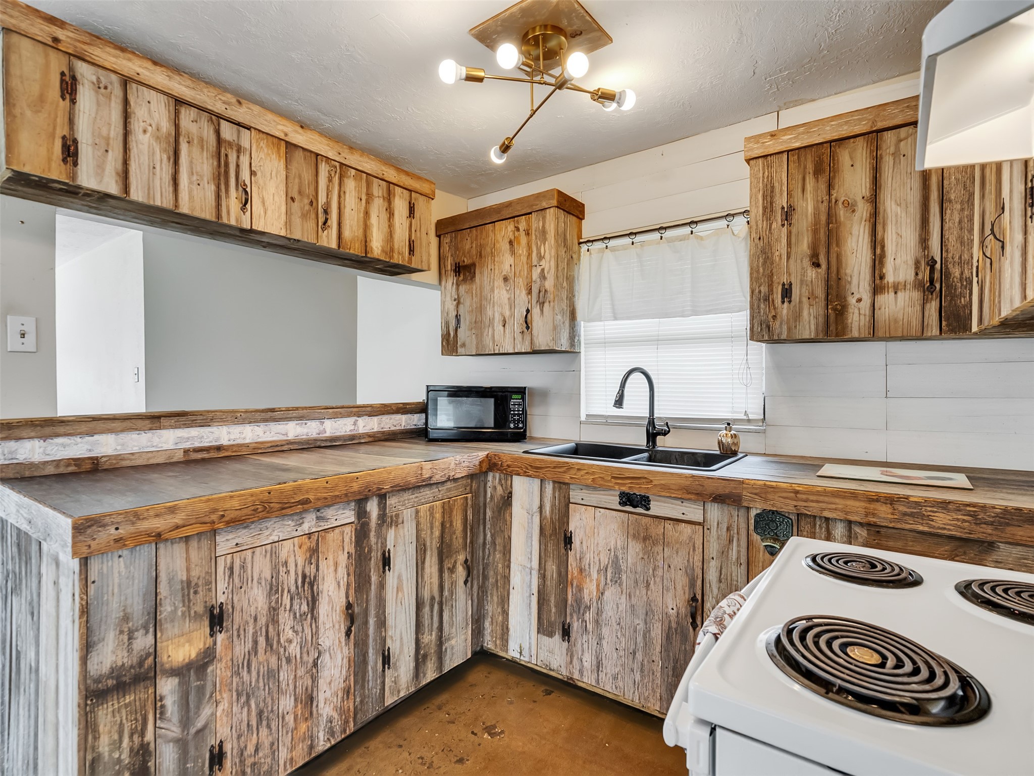 3315 St Anne Street Liverpool, TX 77577 - Photo 35 of 48 a kitchen with stainless steel appliances granite countertop a sink stove and cabinets