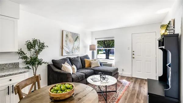 a living room with furniture and a table