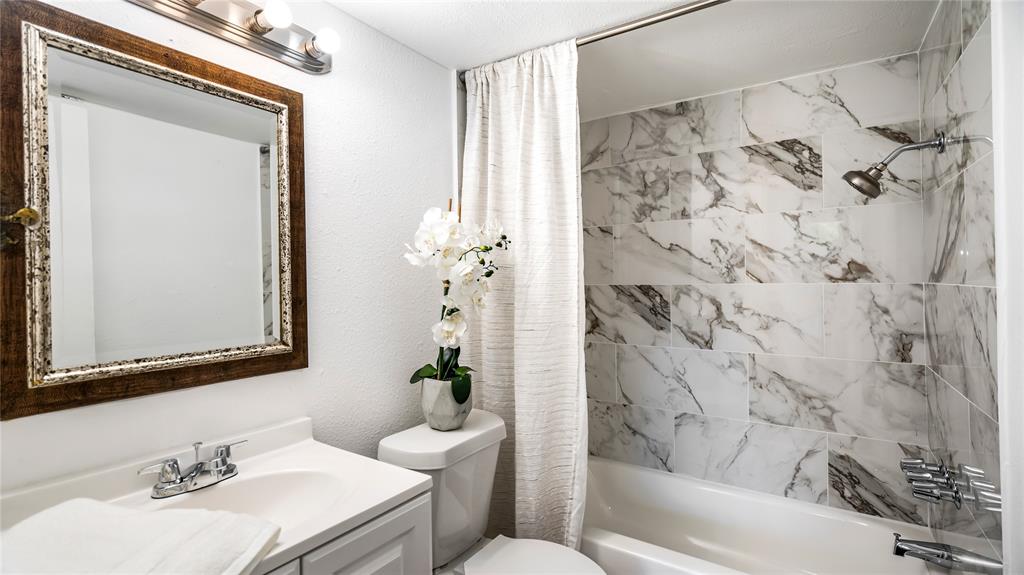 2001 Carl Road Irving, TX 75061 - Photo 16 of 16 a bathroom with a sink toilet and shower