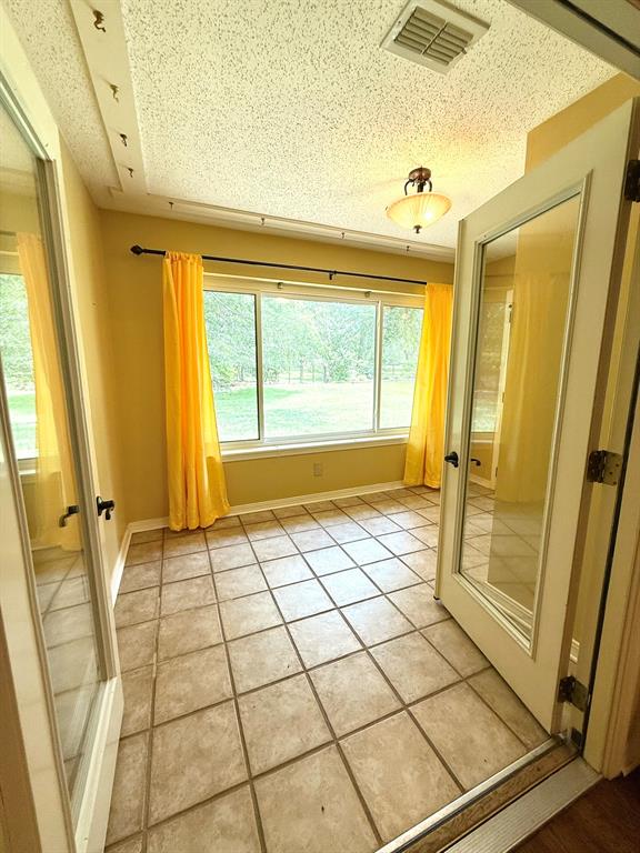11535 Timber Ridge Drive Keithville, LA 71047 - Photo 26 of 39 a view of an empty room with a window