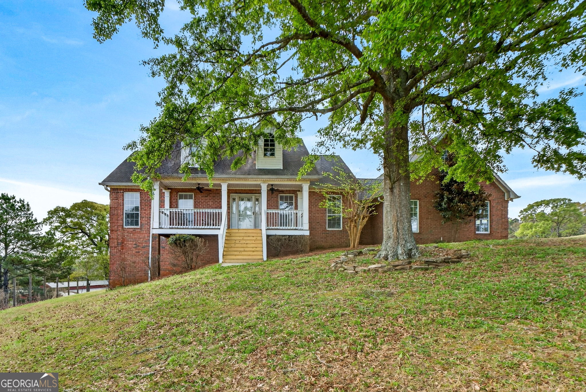 955 Mocassin Gap Road Locust Grove, GA 30248 - Photo 2 of 59 front view of a house with a yard