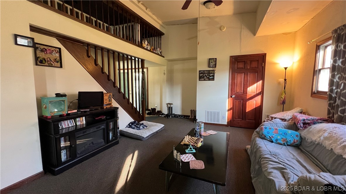 134 West 8th Street Eldon, MO 65026 - Photo 5 of 49 Another angle of the family room...staircase to th