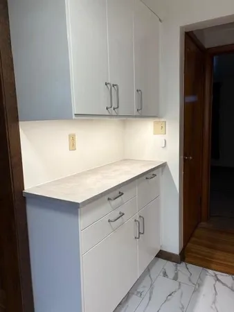 a kitchen with a sink and cabinets
