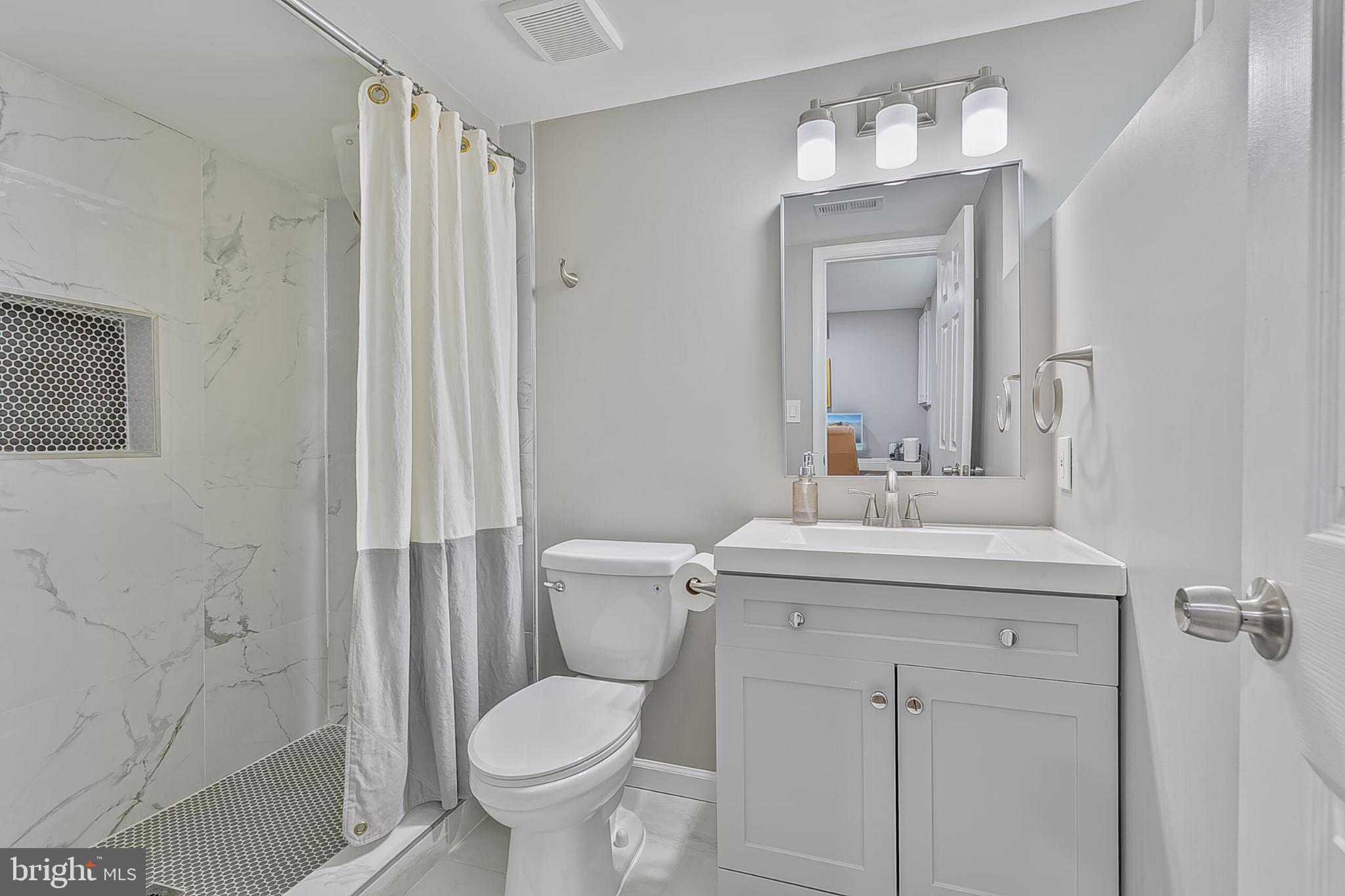 3419 Ramsgate Terrace Alexandria, VA 22309 - Photo 28 of 36 Modern bathroom with sleek finishes.