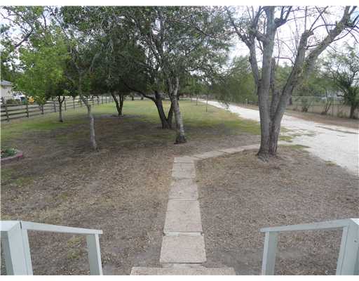 4120 Ballard Road Robstown, TX 78380 - Photo 2 of 8 a view of some trees in the backyard