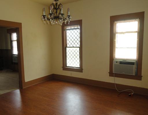 4120 Ballard Road Robstown, TX 78380 - Photo 4 of 8 wooden floor in an empty room with a window