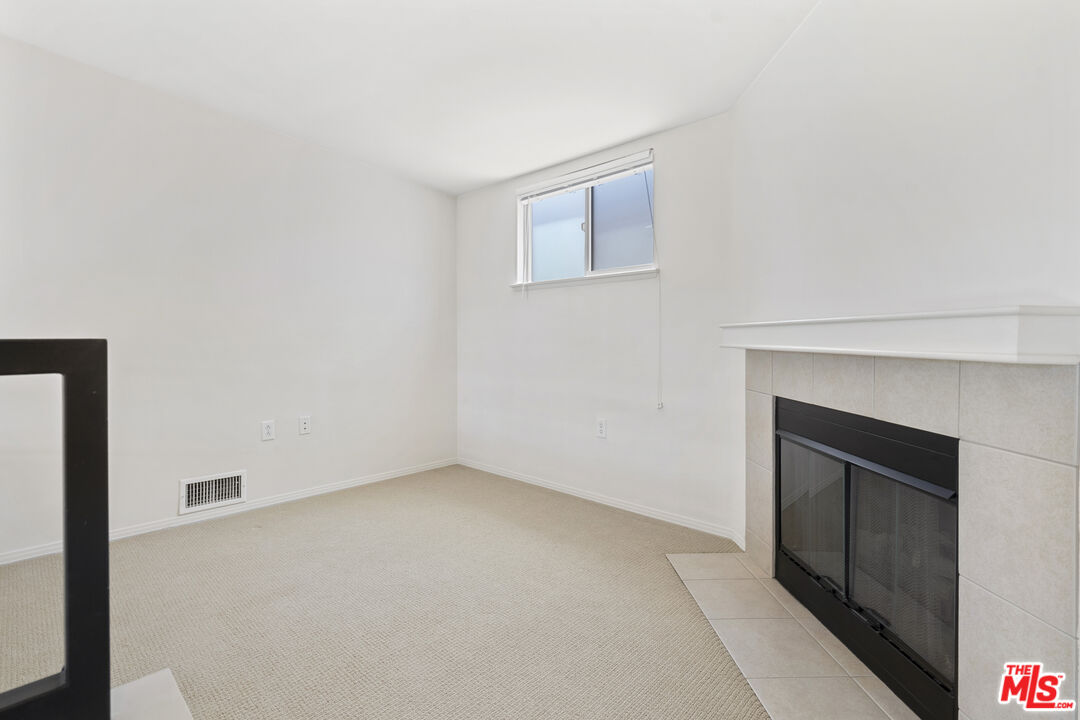 100 South Alameda Street, Unit 418 Los Angeles, CA 90012 - Photo 19 of 32 a view of empty room with a fireplace