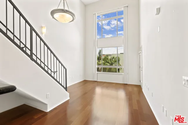 a view of an entryway with wooden floor