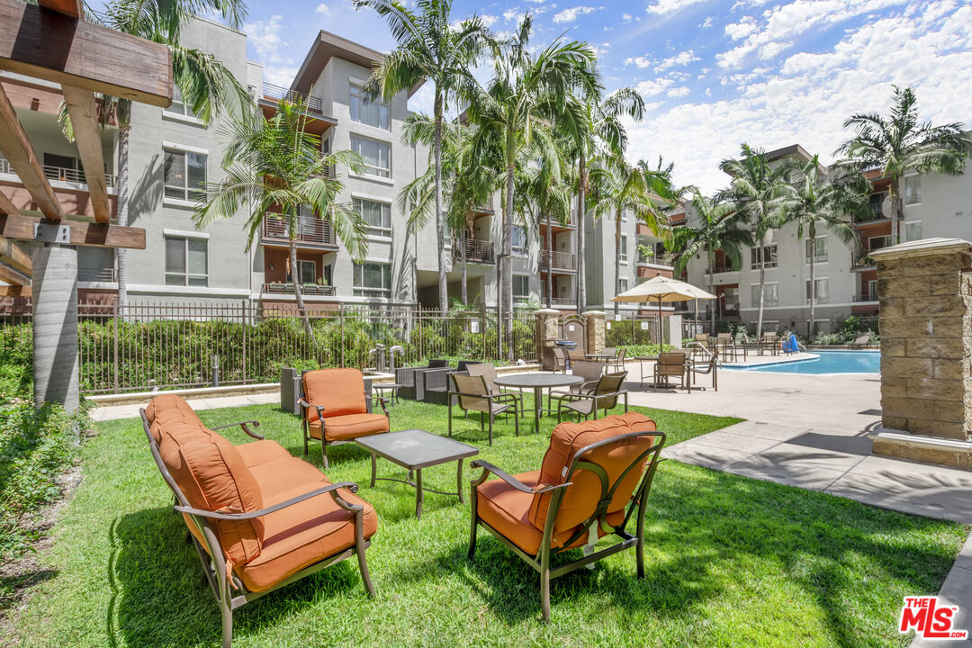 100 South Alameda Street, Unit 418 Los Angeles, CA 90012 - Photo 24 of 32 a view of a chairs in a patio