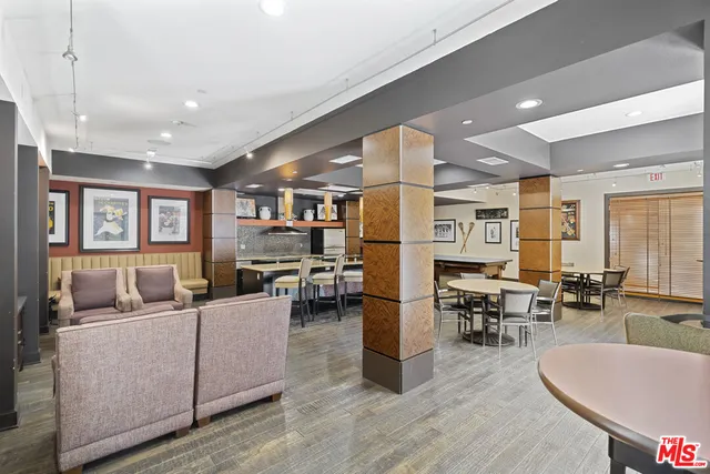 a view of a terrace with couches and sky view