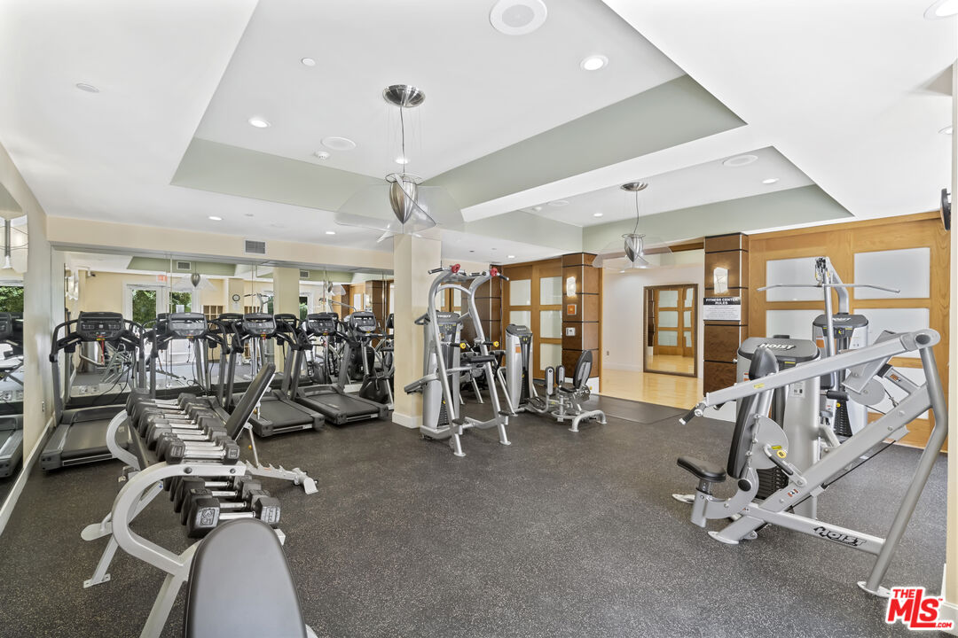 100 South Alameda Street, Unit 418 Los Angeles, CA 90012 - Photo 30 of 32 a view of a room with gym equipment