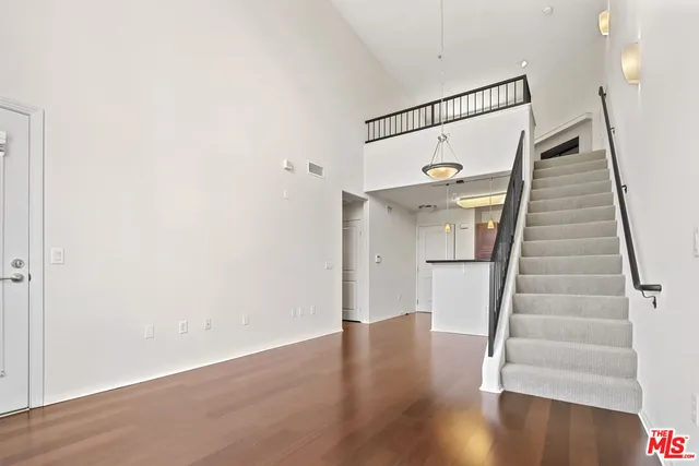 a view of entryway with wooden floor
