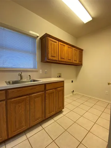 a kitchen with a sink and cabinets