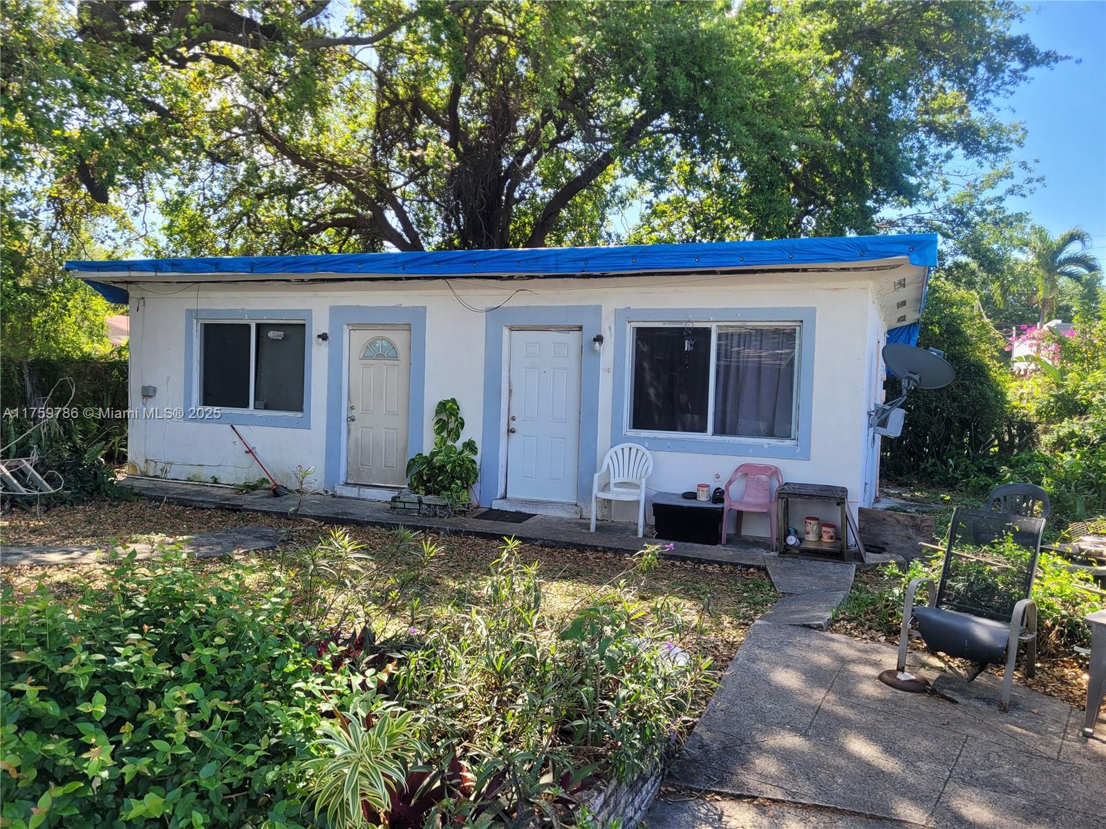 80 Northwest 53rd Street Miami, FL 33127 - Photo 3 of 3 a house view with a garden space