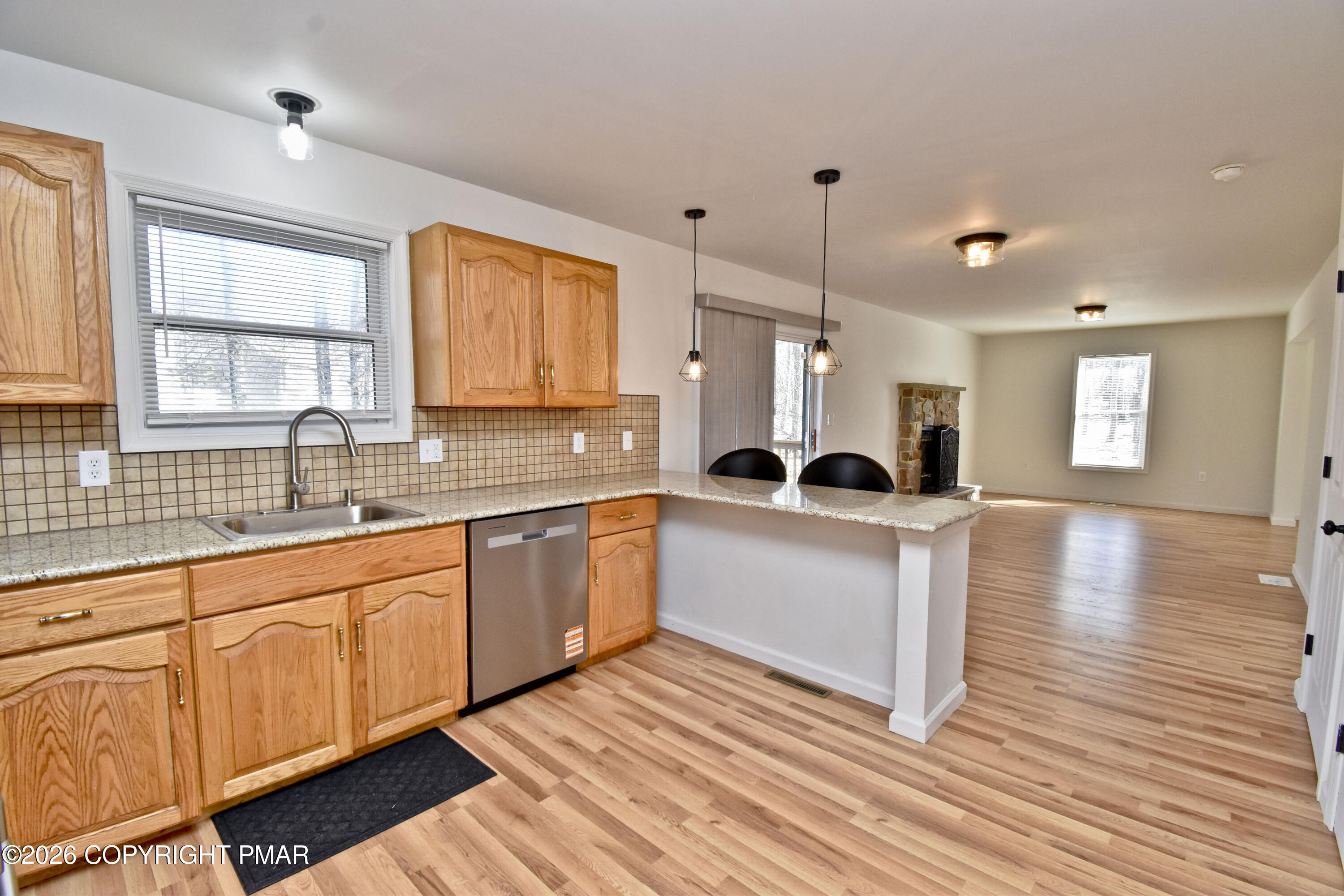 108 Pipher Road Bushkill, PA 18324 - Photo 16 of 50 a large white kitchen with wooden floors