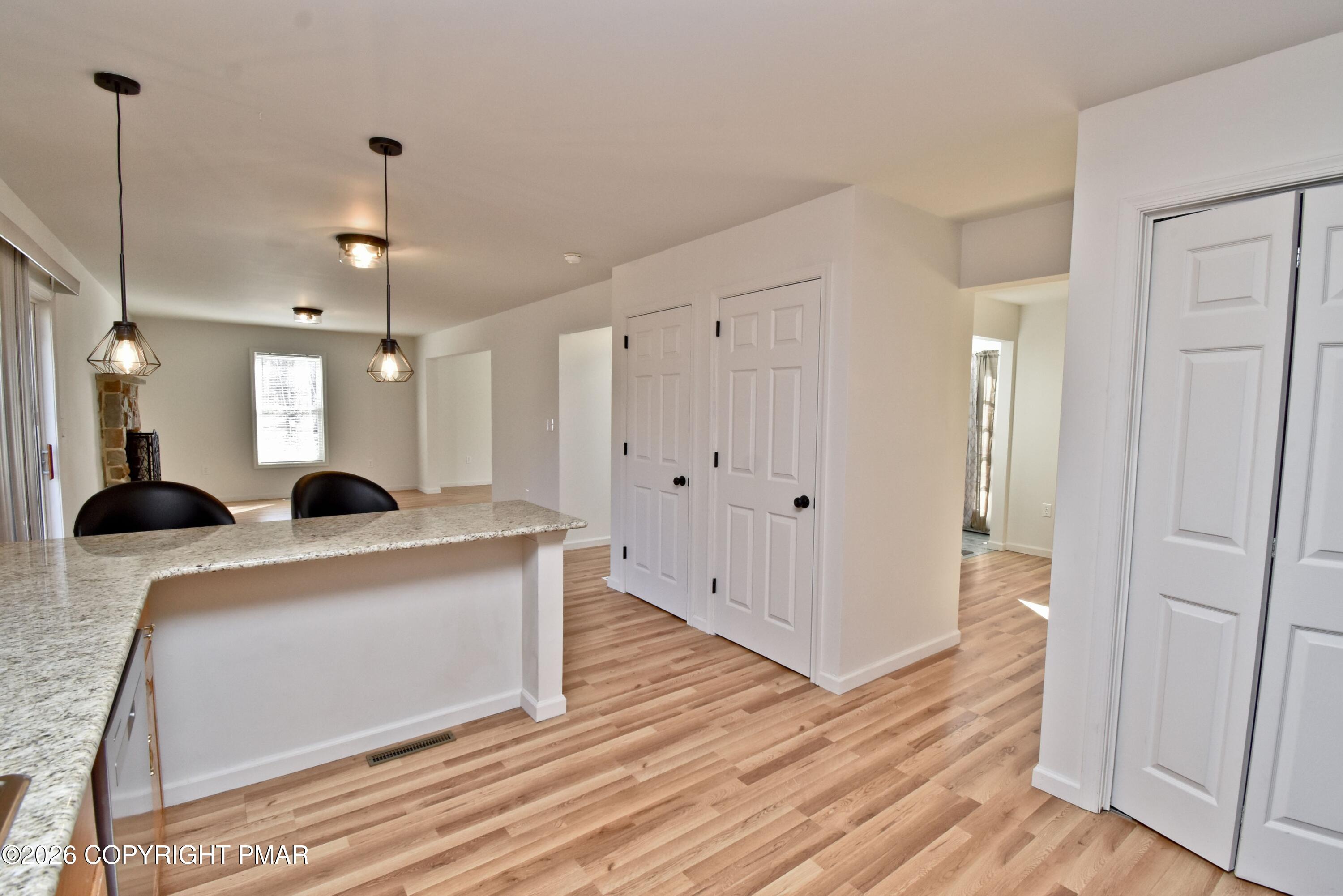 108 Pipher Road Bushkill, PA 18324 - Photo 17 of 50 a view of kitchen with kitchen island wooden floor center island and stainless steel appliances