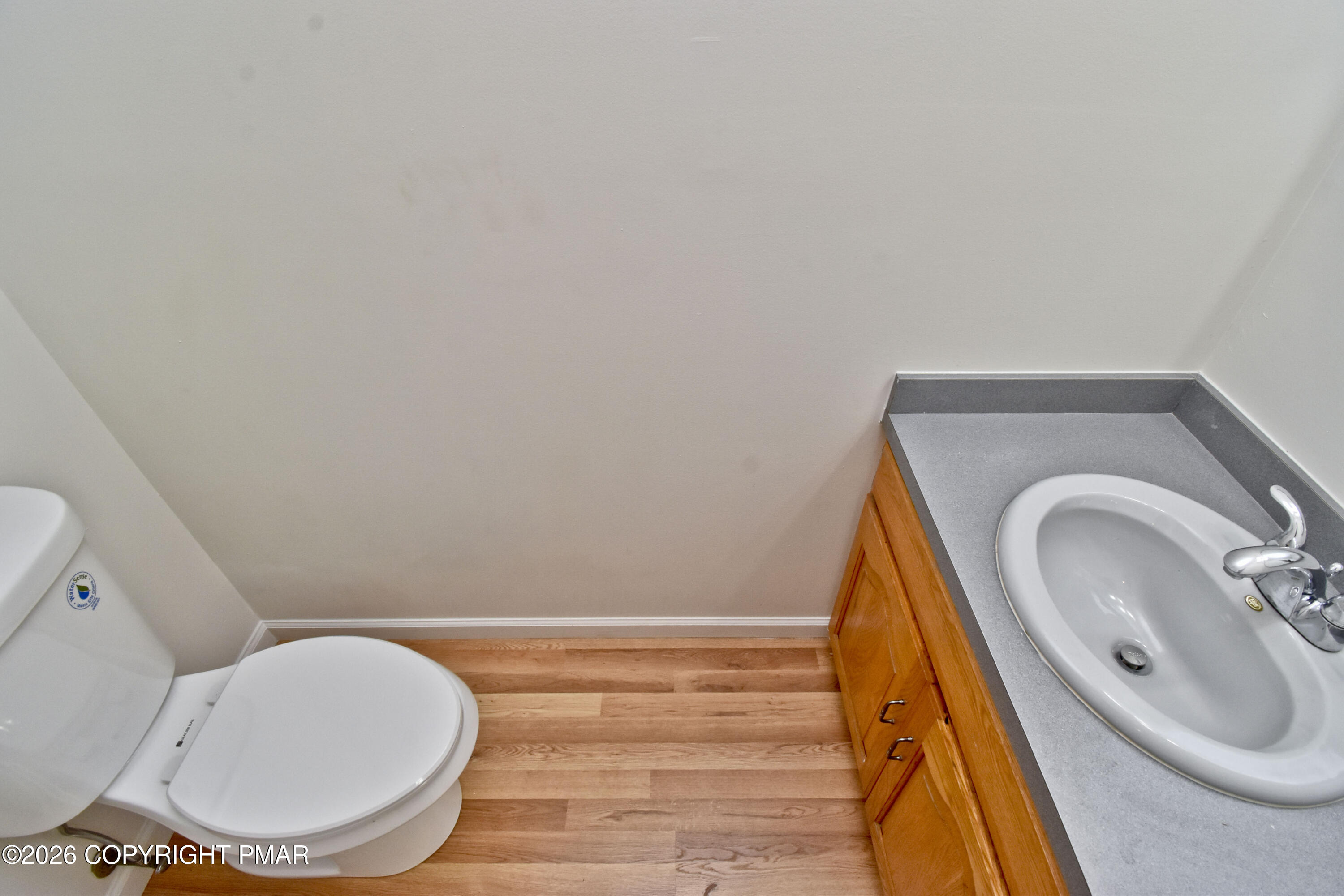 108 Pipher Road Bushkill, PA 18324 - Photo 18 of 50 a bathroom with a toilet mirror vanity and a sink