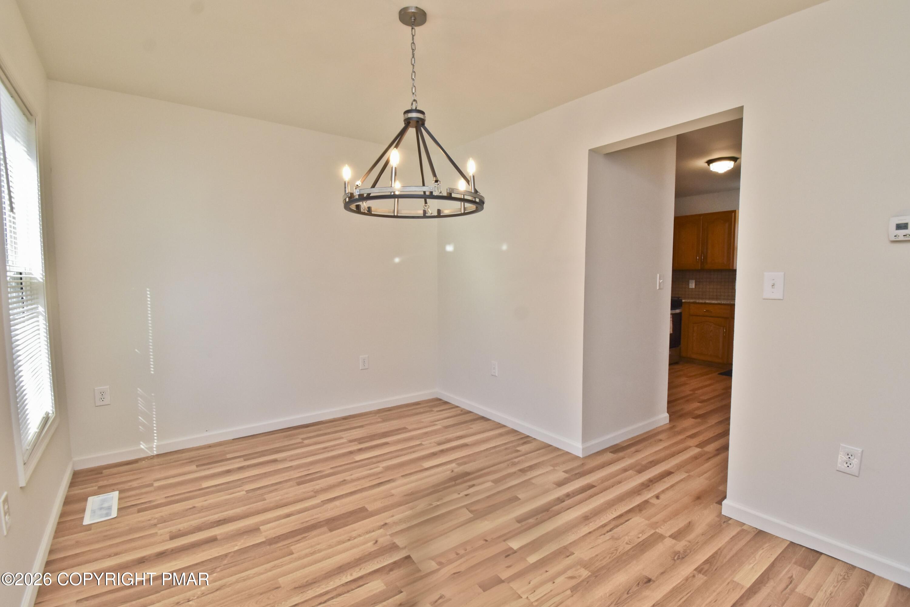 108 Pipher Road Bushkill, PA 18324 - Photo 2 of 50 a view of a room with wooden floor closet and a window